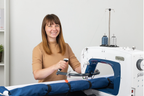 Grace Company Q’nique 16X Longarm Quilting Machine — machine shown with a quilter