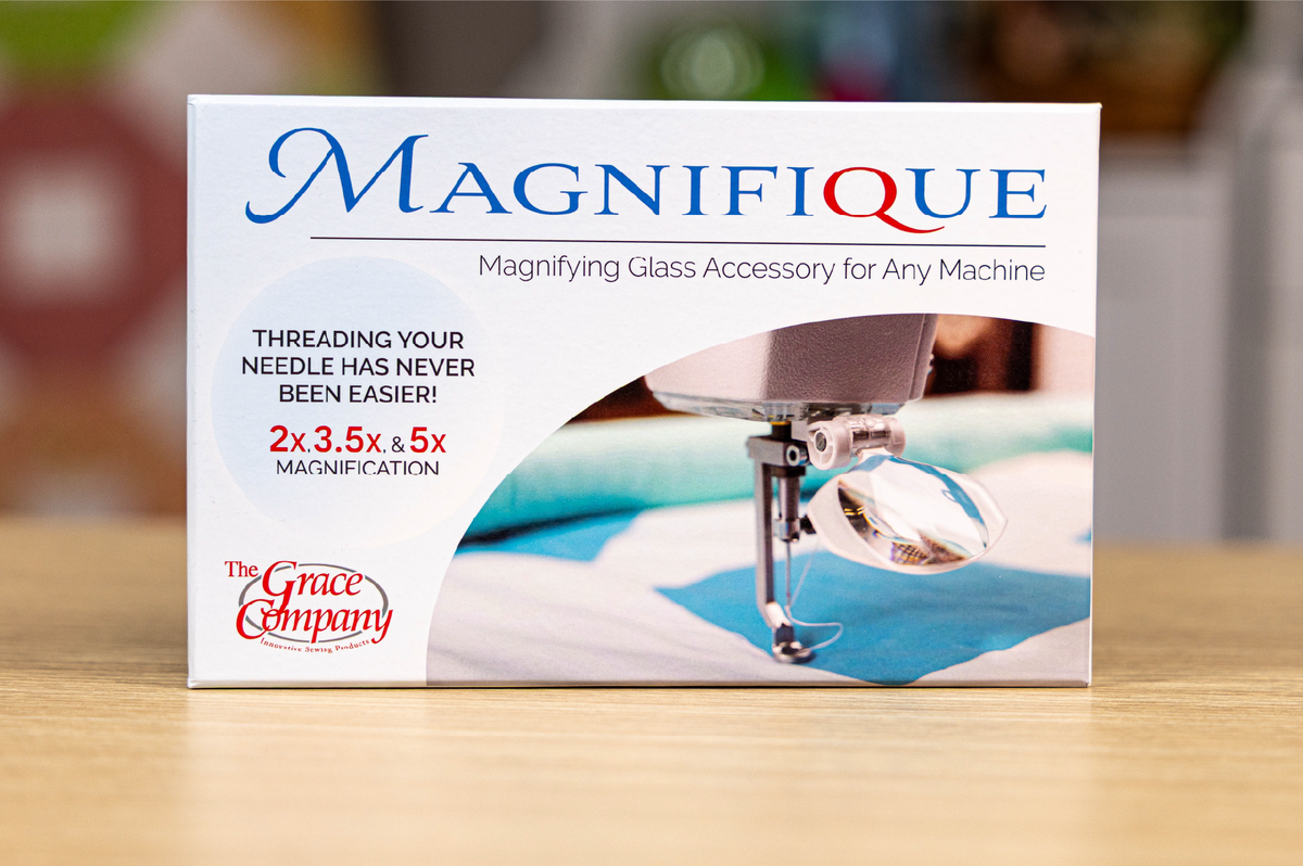 Grace Company Magnifique Magnifying Glass — magnifier package in a sewing room