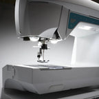 Husqvarna Viking Opal 650 sewing machine needle area illuminated by LED lights for precision stitching and clear visibility