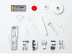Included accessories for the Janome 2030DC-G sewing machine featuring presser feet, bobbins, needles, and maintenance tools.