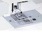 Close-up of the Janome 2030DC-G needle plate, presser foot, and measurement guides for precision stitching