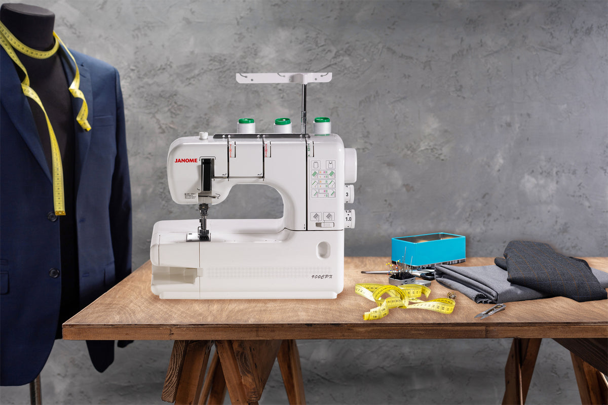 Janome CoverPro 900CPX shown in a sewing workspace