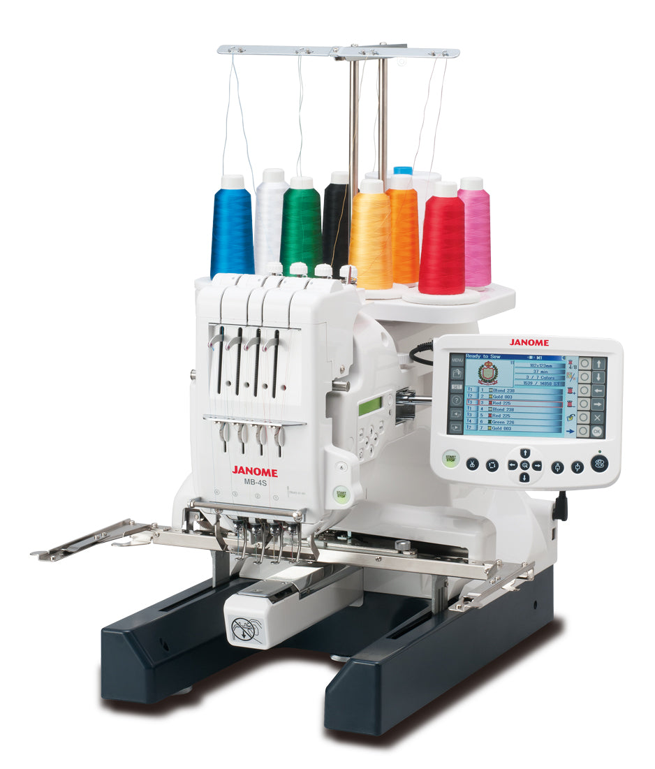 Janome MB-4S four-needle embroidery machine with thread cones and remote screen