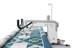 Janome Quilt Maker 15 manufacturer machine and frame view; fabric shown for demonstration
