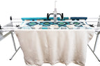 Janome Quilt Maker 15 manufacturer machine and frame view; fabric shown for demonstration