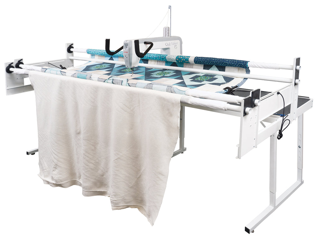 Janome Quilt Maker 15 manufacturer machine and frame view; fabric shown for demonstration