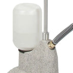 Close-up of the Jiffy 0511 J-2I steamer water bottle and base showing the tank connection and durable construction.