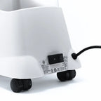 Detail shot of the Jiffy J-2000S steamer power switch and caster wheel