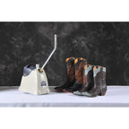 Jiffy SteamBreaker J-4000SBR steamer preparing multiple pairs of leather cowboy boots for shaping and break-in using high-powered steam.