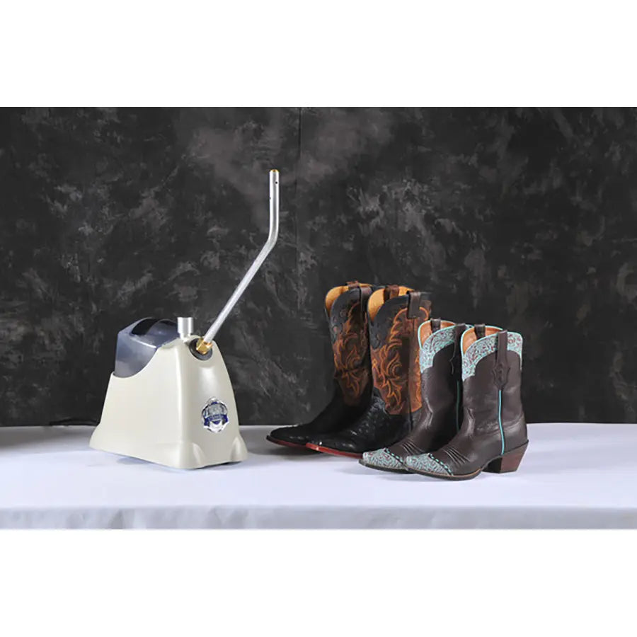 Jiffy SteamBreaker J-4000SBR steamer preparing multiple pairs of leather cowboy boots for shaping and break-in using high-powered steam.