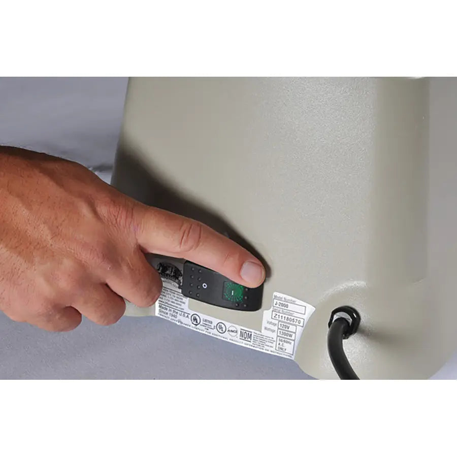 User pressing power switch on Jiffy 2535 SteamBreaker leather steaming unit