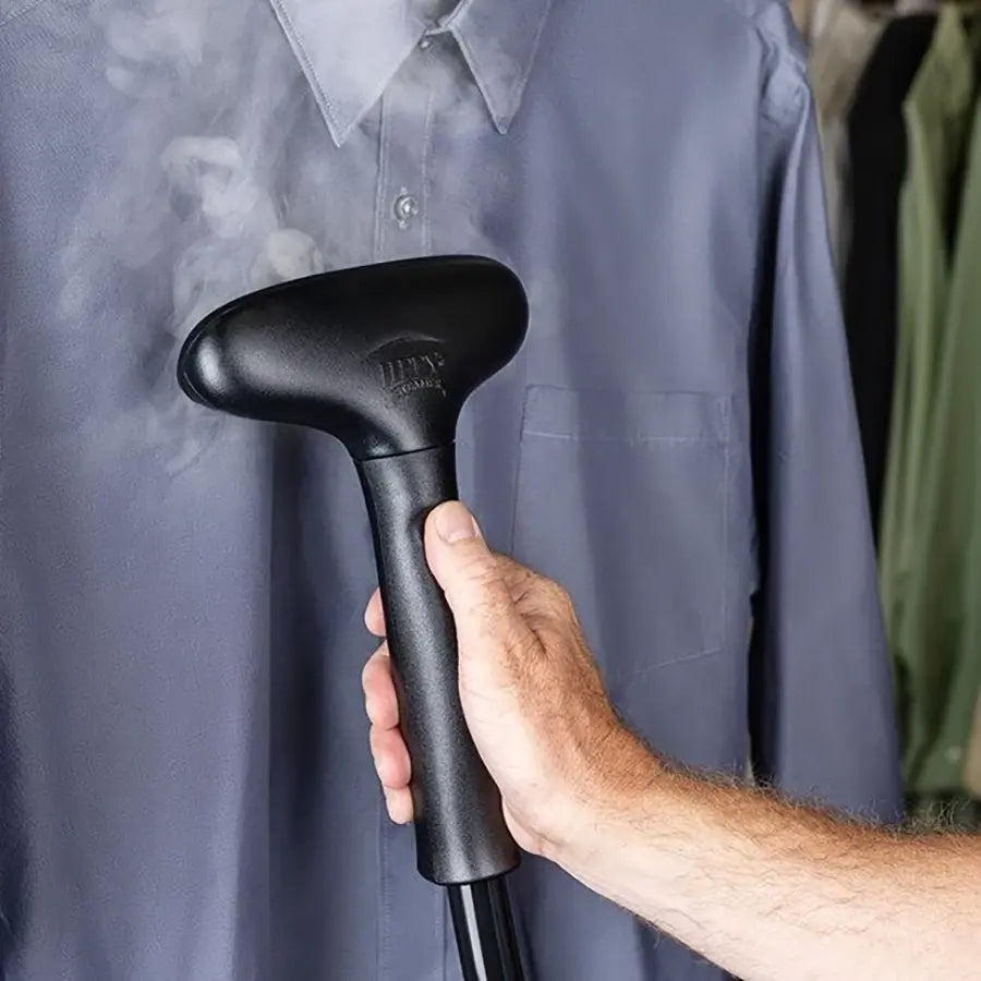 Jiffy J-4000 steamer in use, steaming wrinkles out of a shirt with the standard plastic steam head.