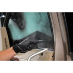Technician peeling window tint using the Jiffy SteamBlade steamer for safe adhesive release