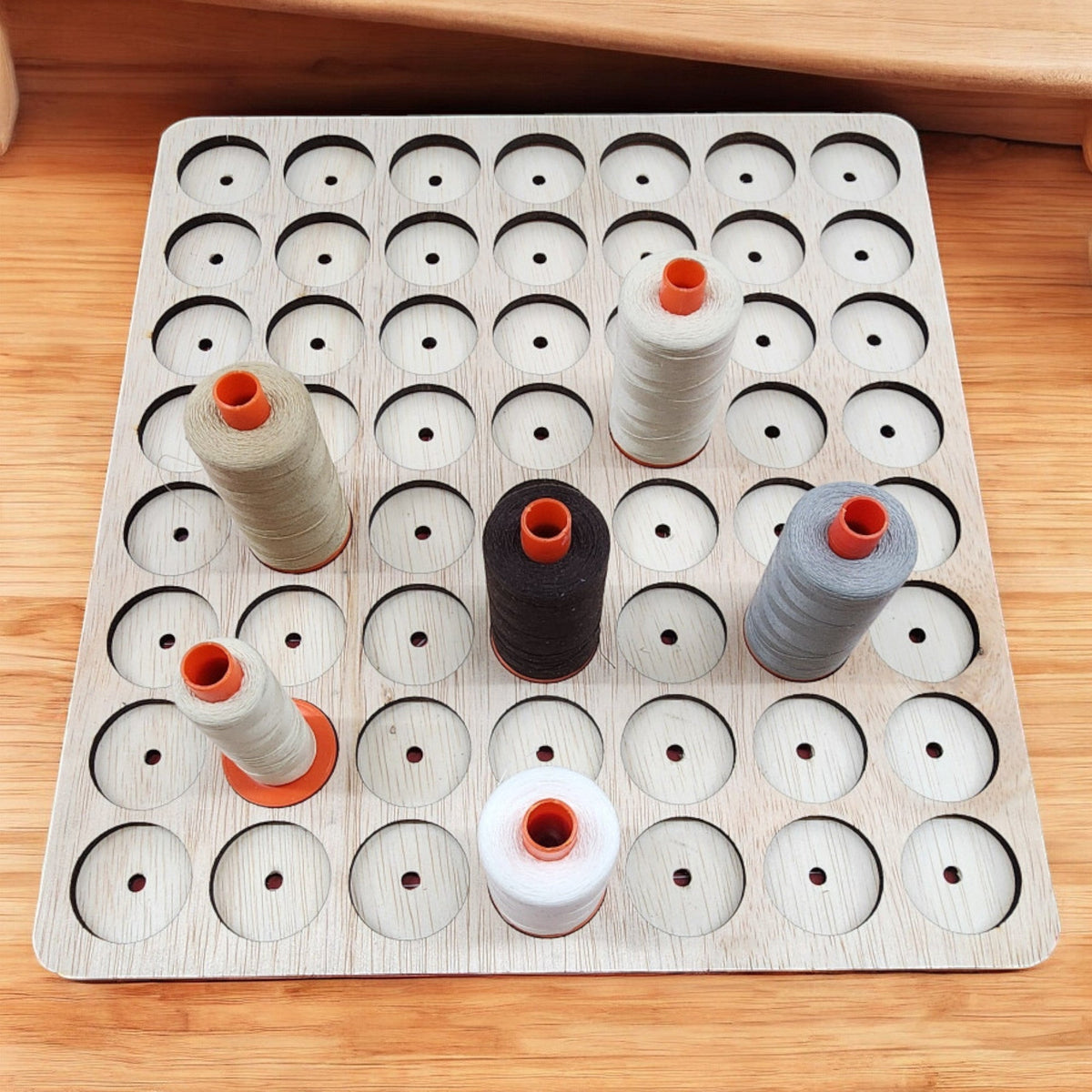 IKEA KALLAX Thread Storage Tray Insert — Aurifil thread samples seated in a wooden tray