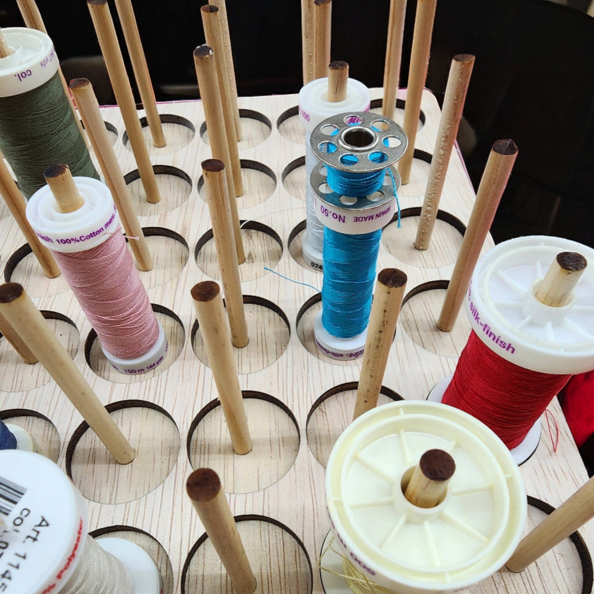 IKEA KALLAX Thread Storage Tray Insert — tray with dowel rods holding thread spools and bobbins