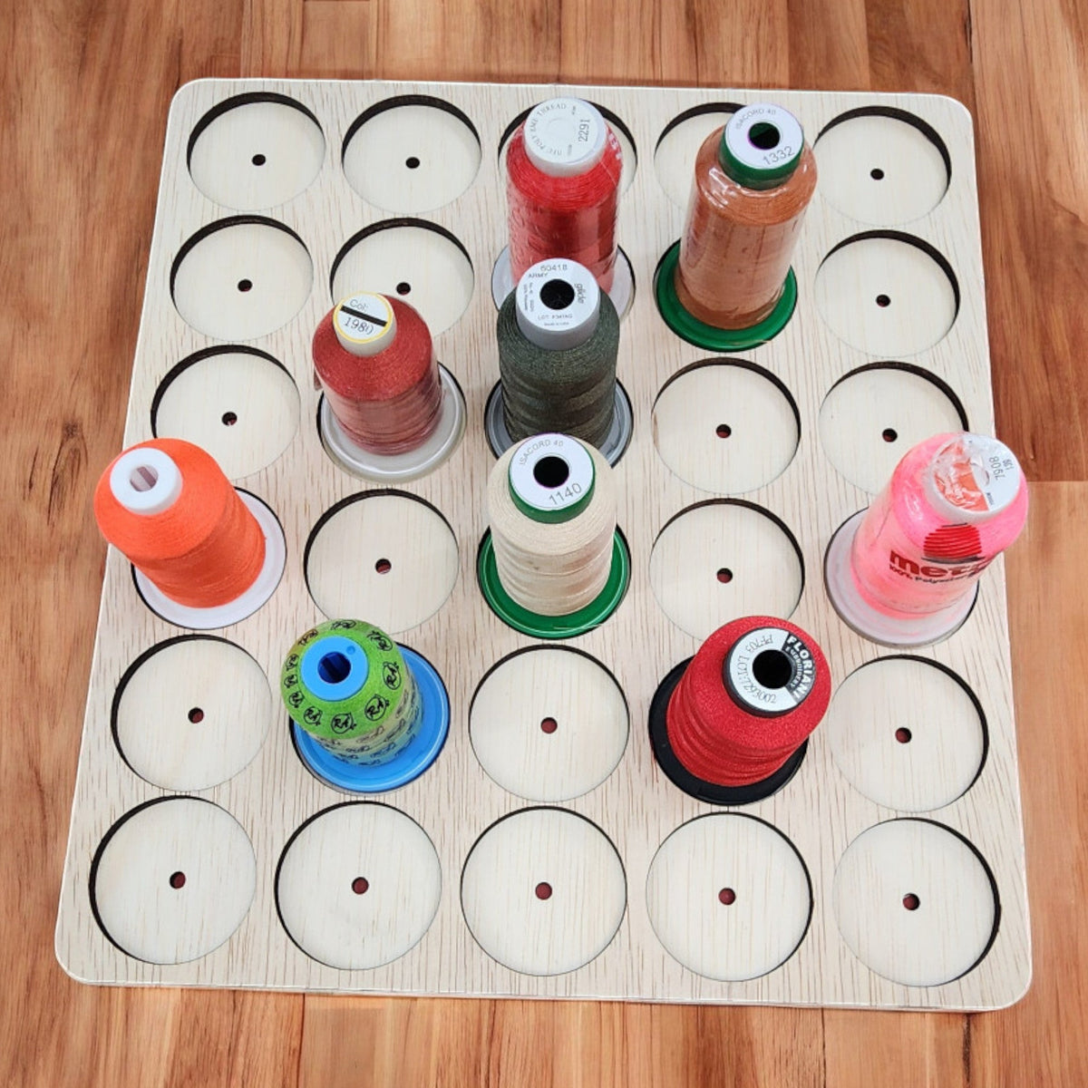 IKEA KALLAX Thread Storage Tray Insert — overhead view of tray with dowel holes and sample spools
