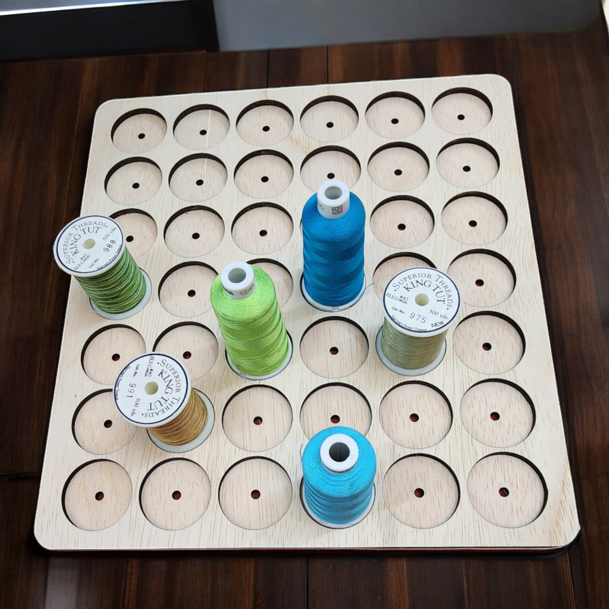 IKEA KALLAX Thread Storage Tray Insert — overhead view of tray with assorted thread spools