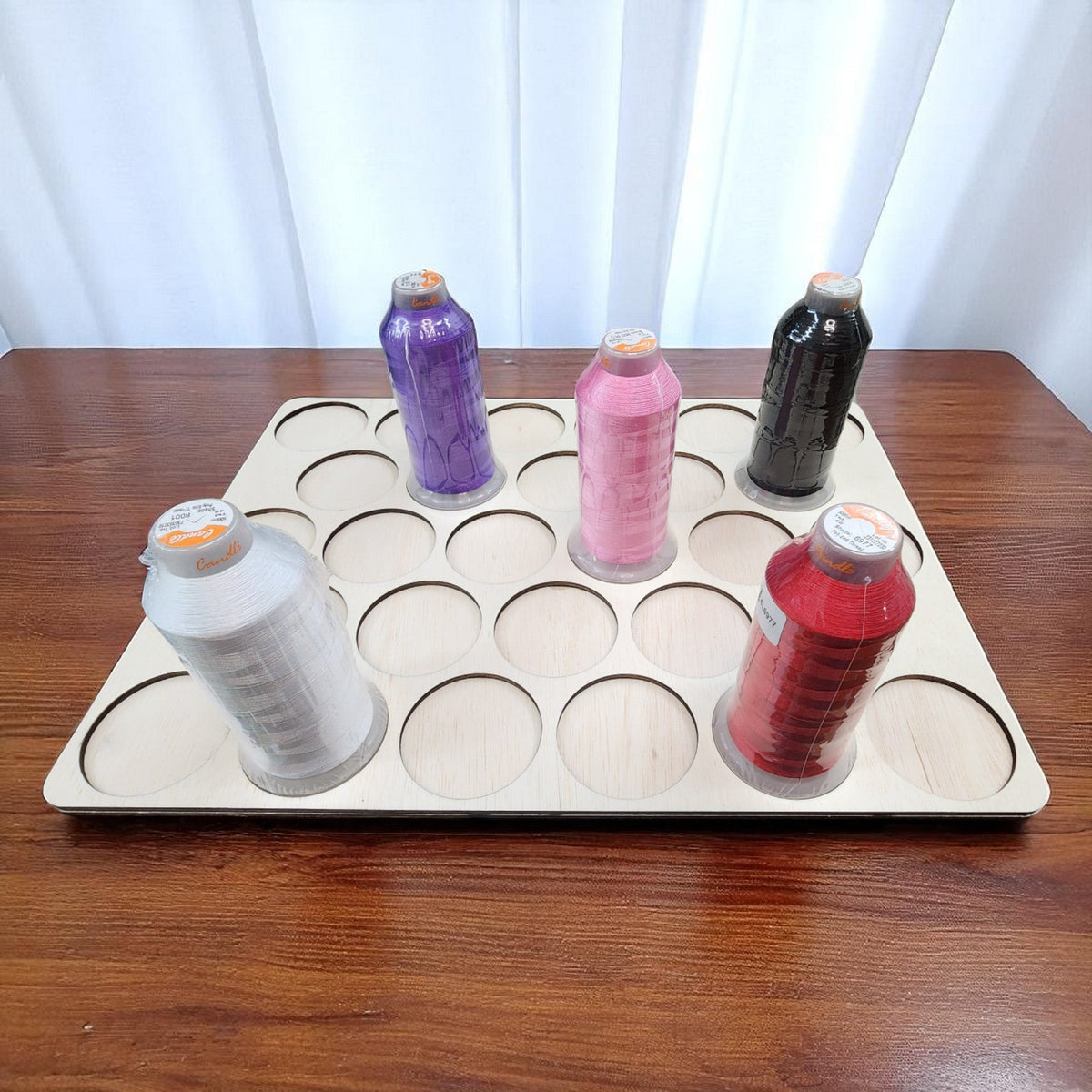 King Spool Thread Storage Tray for 5,000m Spools — angled view with several large thread spools