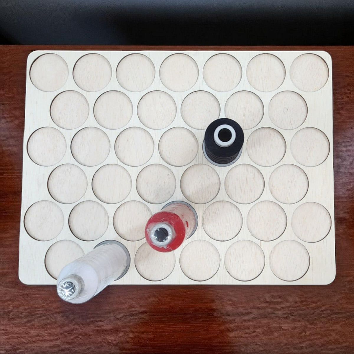 King Spool Thread Storage Tray for 5,000m Spools — smaller-opening tray with three sample spools