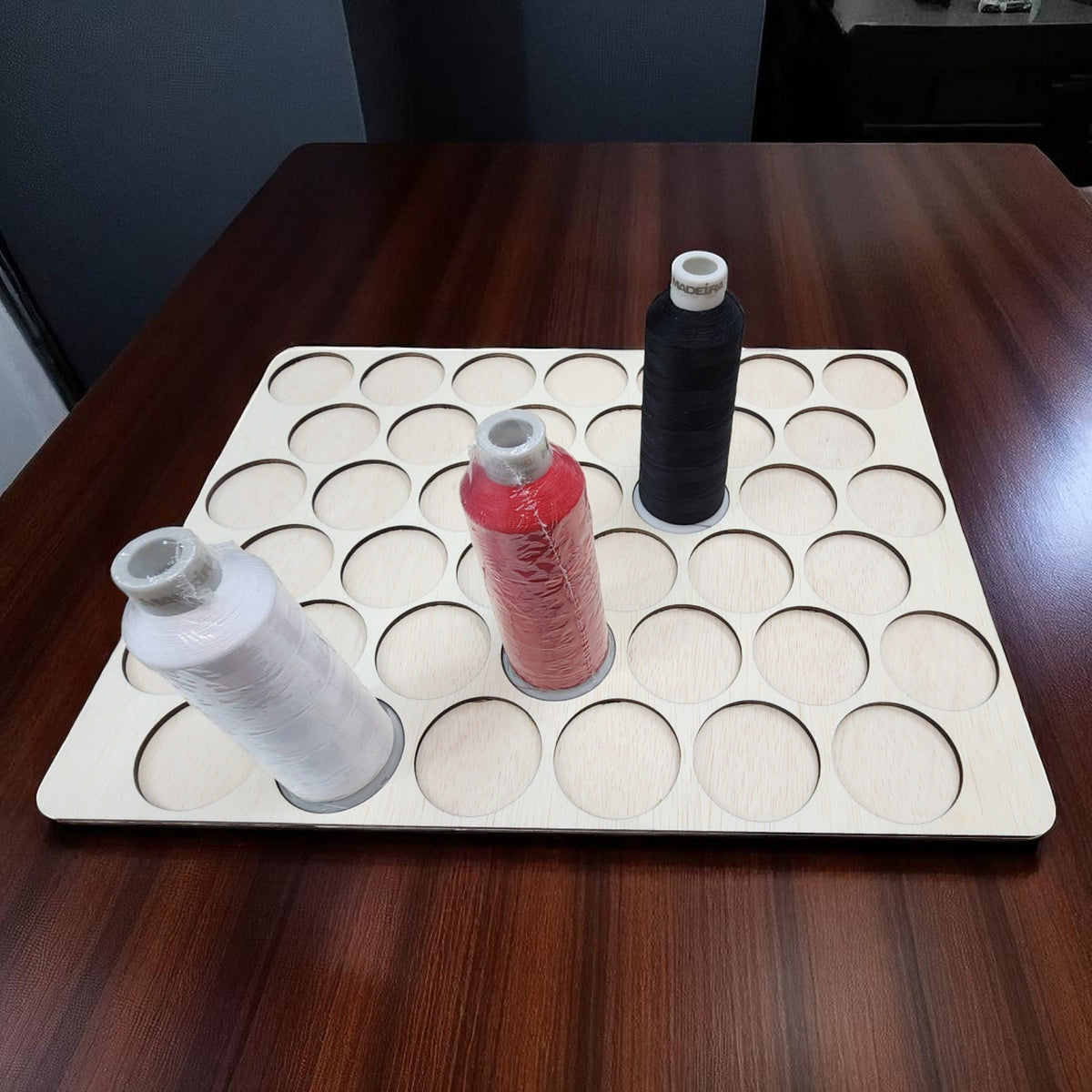 King Spool Thread Storage Tray for 5,000m Spools — angled view of the smaller-opening tray with three spools