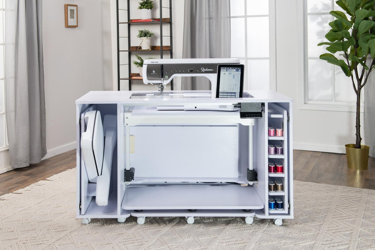 Koala All-In-One Embroidery Studio in White Ash with storage open; machine and supplies shown for illustration