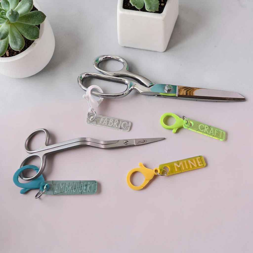 Fabric, Embroidery, Craft, and Mine scissor fobs shown with scissors for illustration