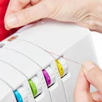 Easy View Threading system on SINGER SE017 Elite serger with color-coded tension dials for simplified looper threading