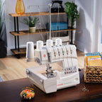 SINGER Professional 5 serger sewing machine set up on sewing table with thread stand, ideal for garment construction and professional seam finishing