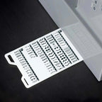 Close-up of SINGER Heavy Duty 6600C stitch guide card showing built-in stitch patterns and applications