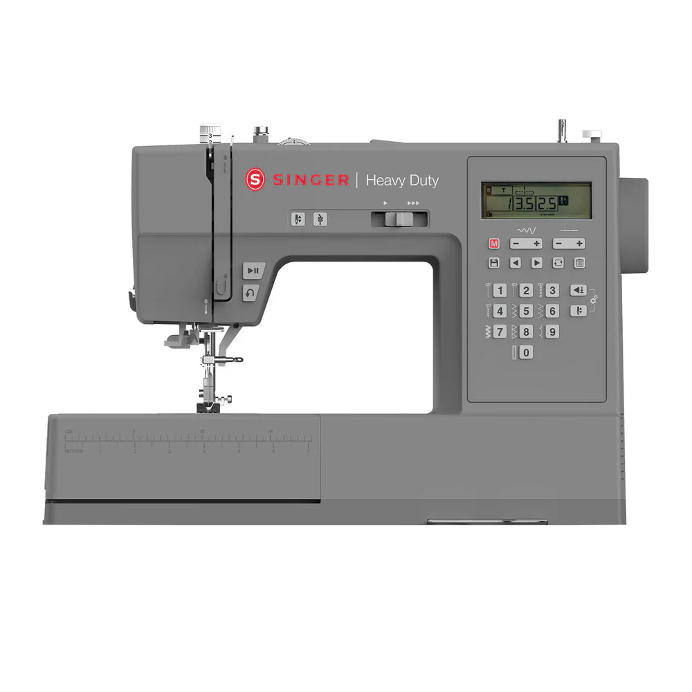 SINGER Heavy Duty 6700C computerized sewing machine front view with digital control panel and extended throat space