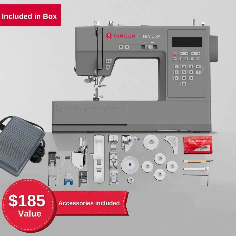 SINGER Heavy Duty 6700C sewing machine accessories included in box with presser feet, bobbins, foot pedal, and tools
