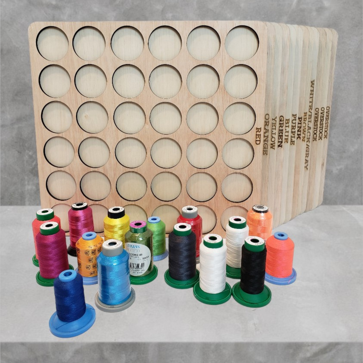 Sort-by-Color Thread Storage Trays, 432 Spools — wooden trays behind an assortment of colored thread spools