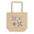 Natural-color Pastel 1 tote with a square patchwork print in pink, blue, green and yellow above It's a good day to quilt lettering.