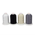 Four Sulky cotton thread cones in white, black, cream and gray from the Long Arm Quilter Basics Sampler.