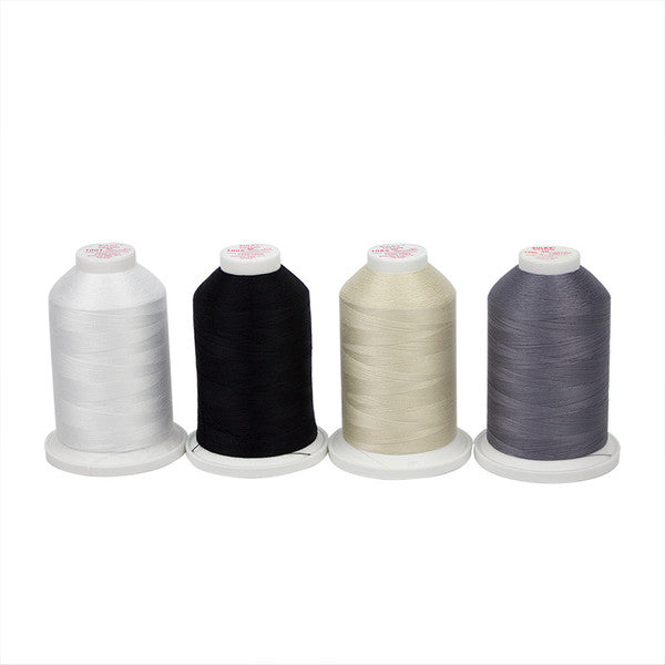 Four Sulky cotton thread cones in white, black, cream and gray from the Long Arm Quilter Basics Sampler.