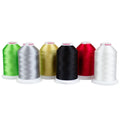 Six Sulky rayon thread cones in green, silver-gray, gold, black, red and white, arranged in a row.