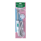 Clover Mini Iron in its retail package, with a narrow pressing tip, white-and-green handle and coiled power cord.