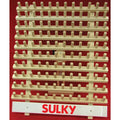 Empty wooden Sulky thread rack with rows of upright pegs and a red SULKY logo across the base.