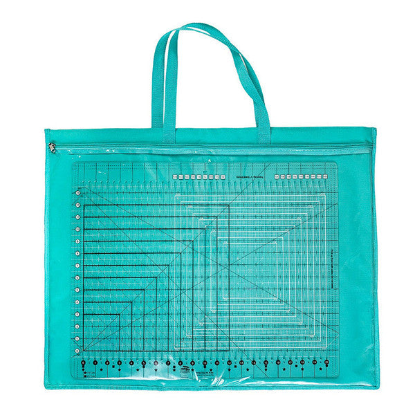 Teal ToteOlogy bag with large quilting rulers visible through its full-width clear pocket.