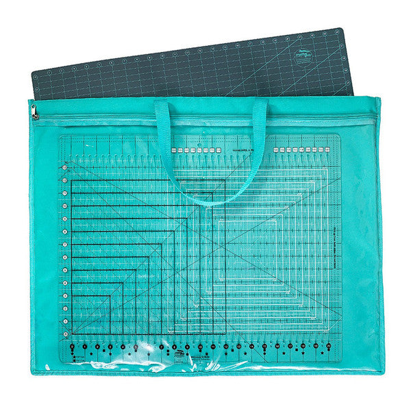 Teal ToteOlogy bag holding quilting rulers, with a large cutting mat extending above the top opening.