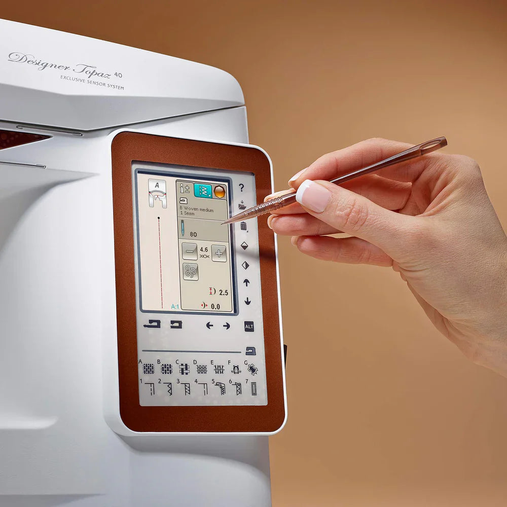 Close-up of Husqvarna Viking Designer Topaz 40 color touch screen showing stitch settings and sewing controls