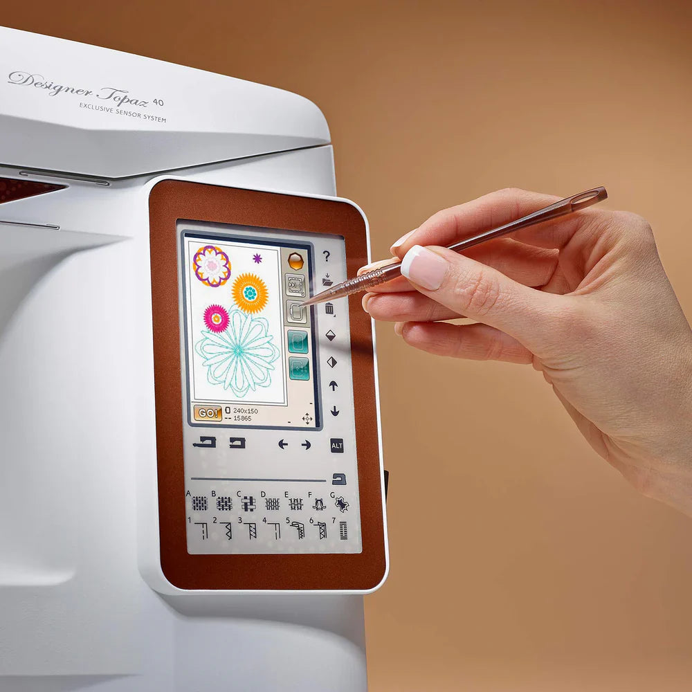 Husqvarna Viking Designer Topaz 40 touch screen displaying embroidery design editing and positioning interface