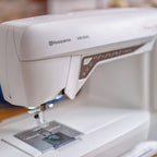 Husqvarna Viking Designer Topaz 40 sewing machine needle area with LED lighting and presser foot detail