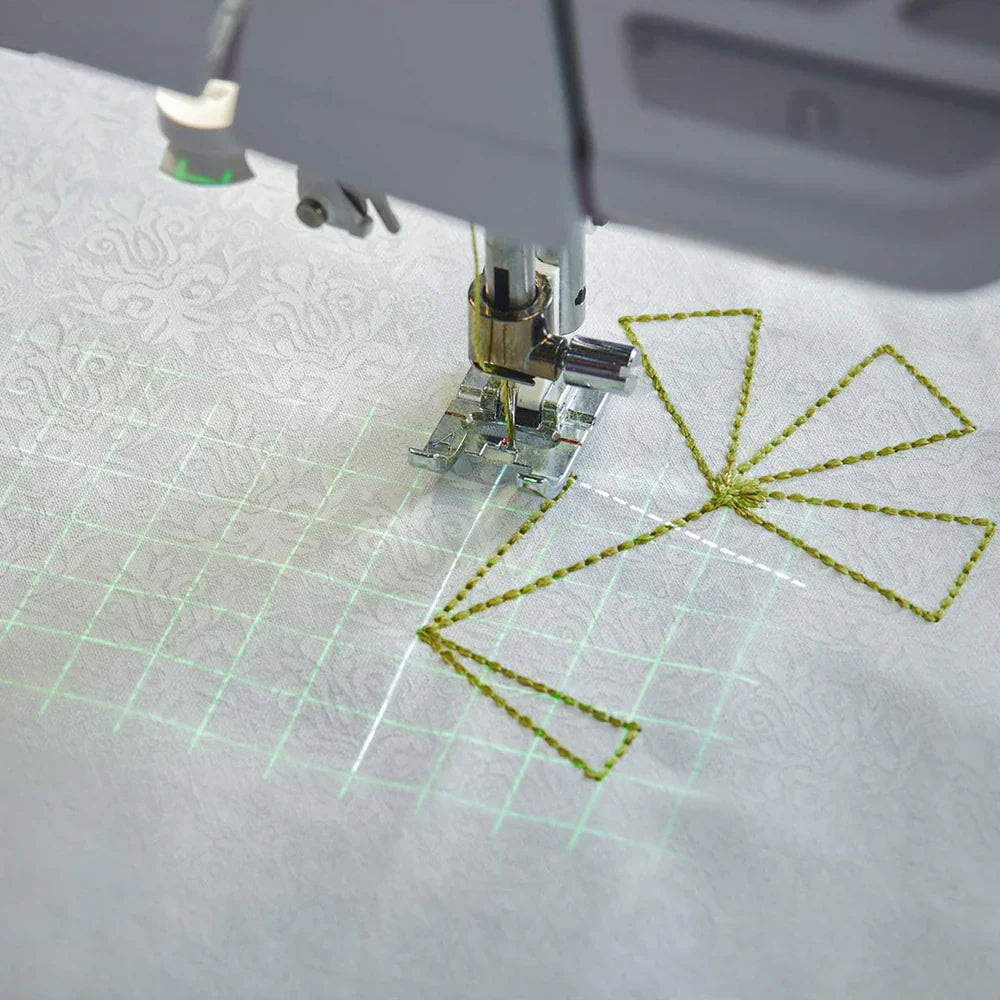 Sewing projection grid and stitch placement guide displayed on fabric while quilting with the EPIC QUILT 97 sewing machine