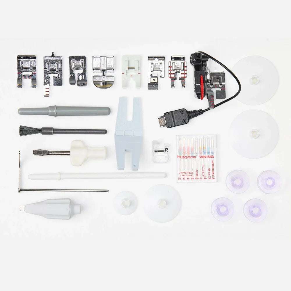 Included accessories and presser feet for Husqvarna Viking Designer Topaz 65 sewing and embroidery machine