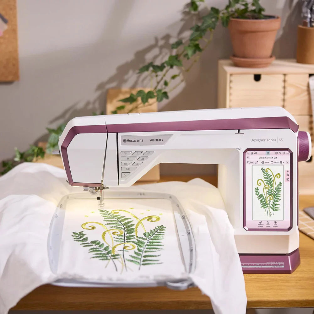 Husqvarna Viking Designer Topaz 65 embroidery machine stitching detailed floral embroidery design on fabric