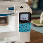 Husqvarna Viking Opal 670 touch screen display showing stitch settings and sewing advisor interface