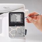 Close-up of Husqvarna Viking Opal 690Q touchscreen showing Exclusive Sewing Advisor fabric and technique settings