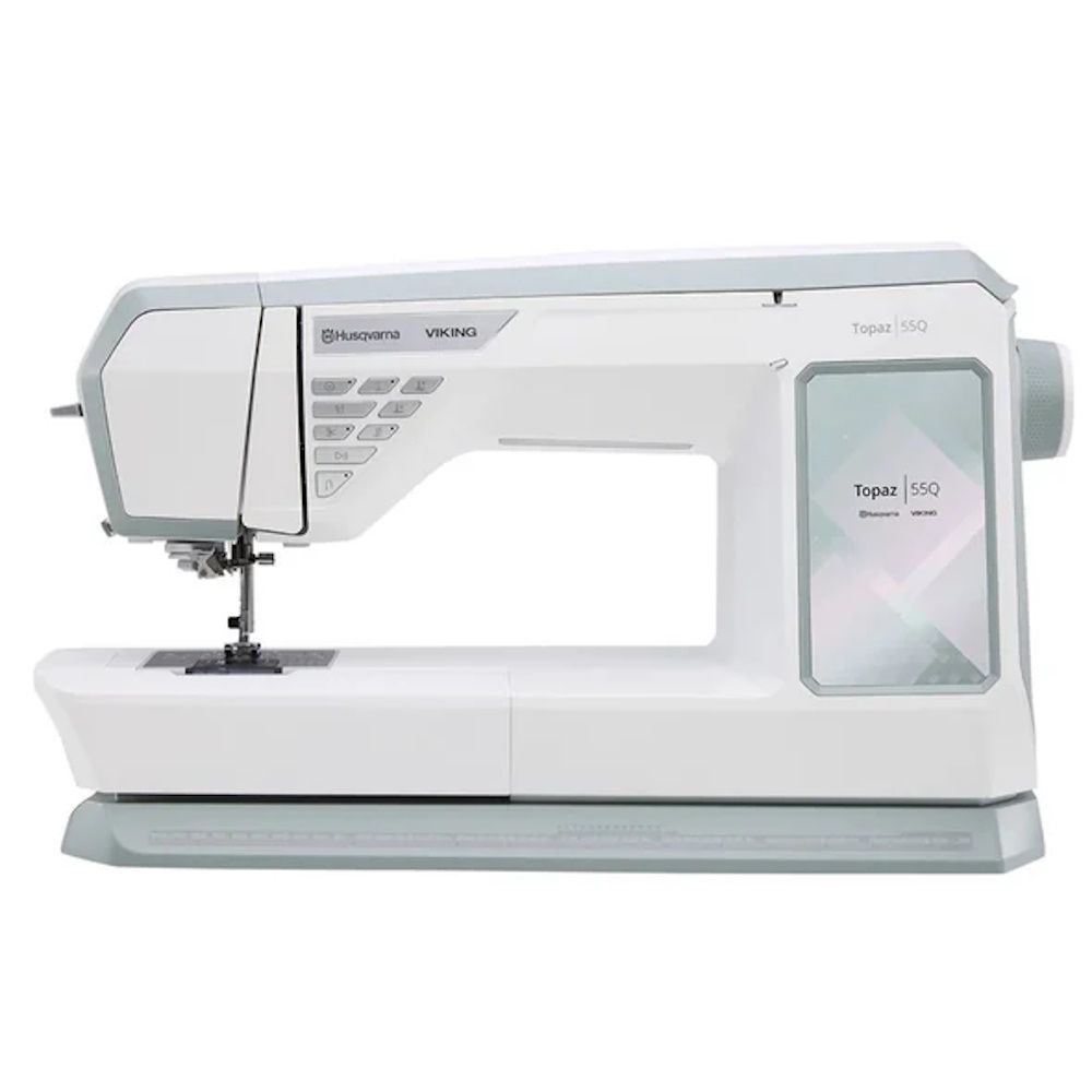 Husqvarna Viking Topaz 55Q computerized sewing machine side view featuring large workspace and color touchscreen