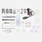 Husqvarna Viking Topaz 55Q sewing machine accessories including presser feet, bobbins, needles, tools, and power cable